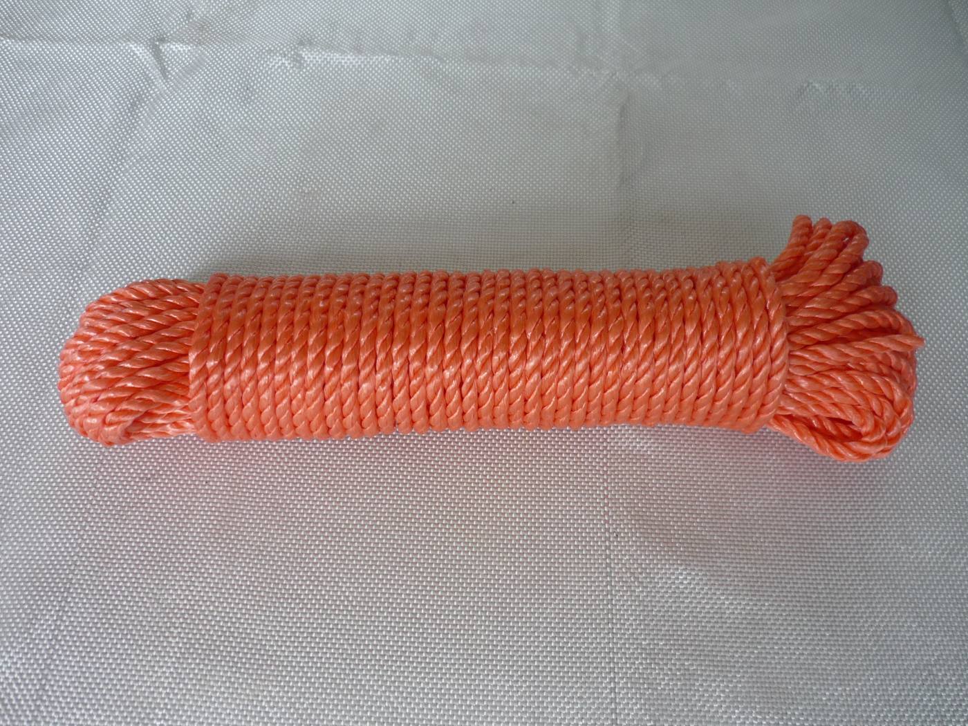 Orange 3-strand twisted polypropylene rope spool, side view